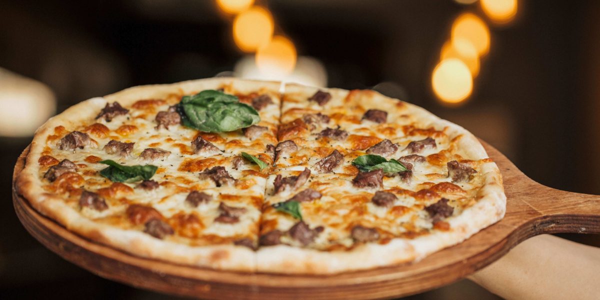 mixed-ingredient-pizza-wooden-board